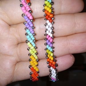 2 different styles of handmade rainbow bracelets